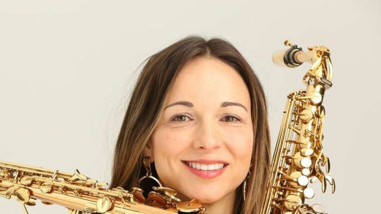 Female holding different wind instruments