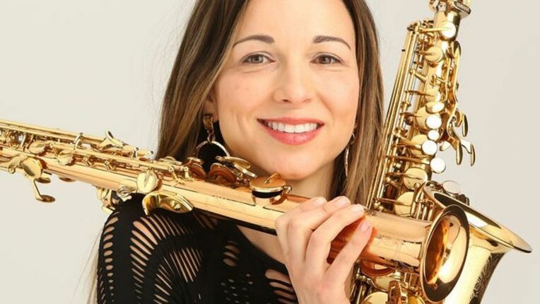 Female holding different wind instruments
