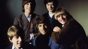 Five members of the band, The Yarbirds, smile for the camera.