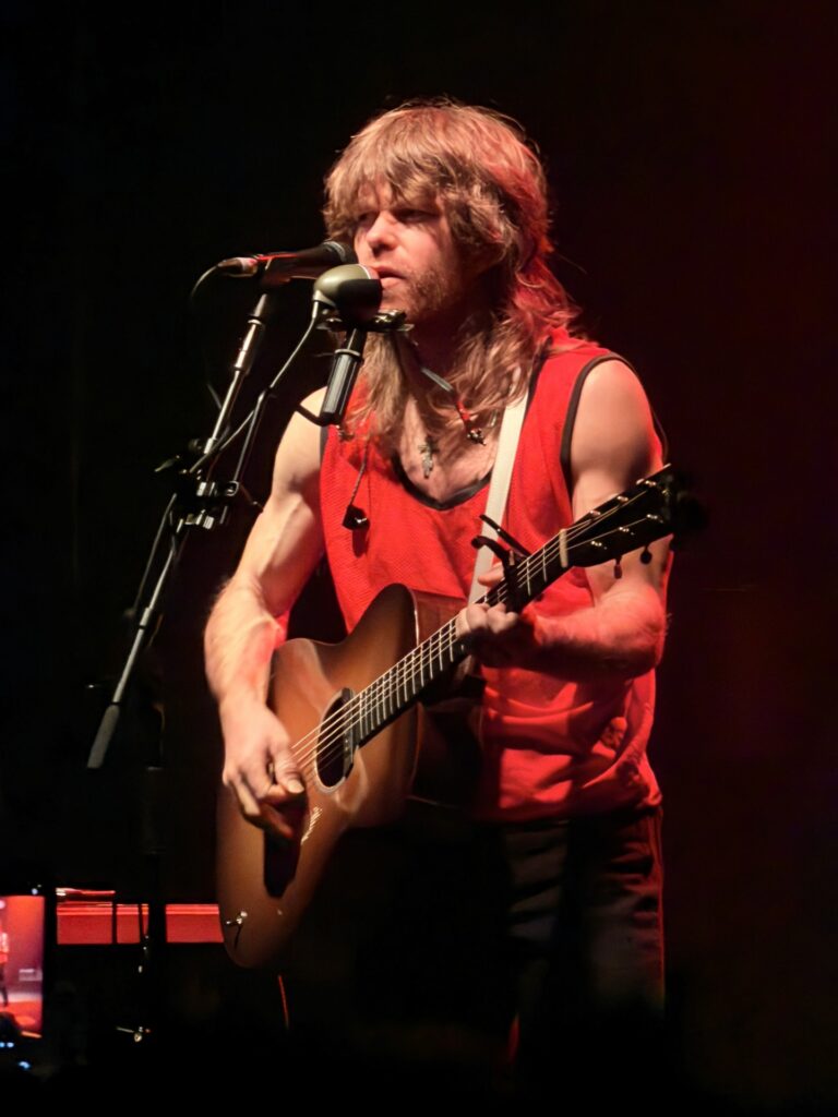 American singer-songwriter and guitarist Jesse Welles performing live on stage