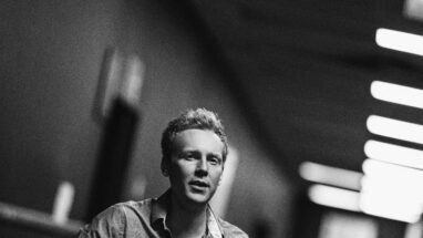 Image of man holding a guitar