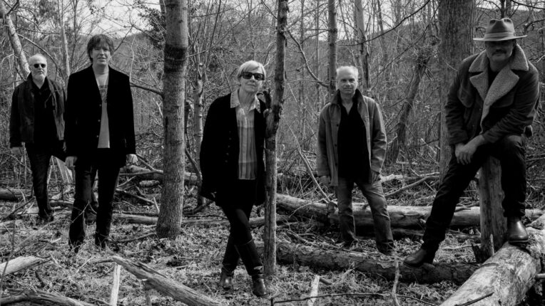 Five people outside in the woods