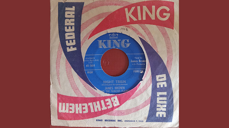 45 rpm record with colorful pink, red, and blue cover