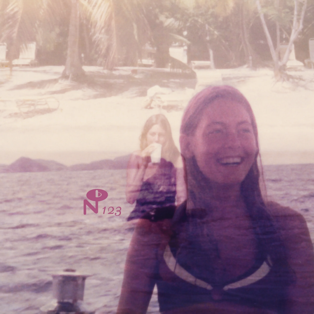 Cover of Cathy Hamer's album, Lady Full of Dreams. Cathy smiles in a swimsuit, super imposed over another photo of her drinking a beverage while sitting in the sea. A beach with palm trees in the further backdrop.