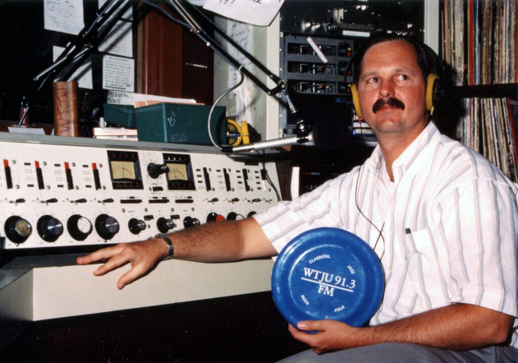 Chuck Taylor at the WTJU air studio console in Peabody Hall, circa 1990