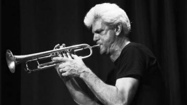 Jazz musician John D'Earth plays his trumpet