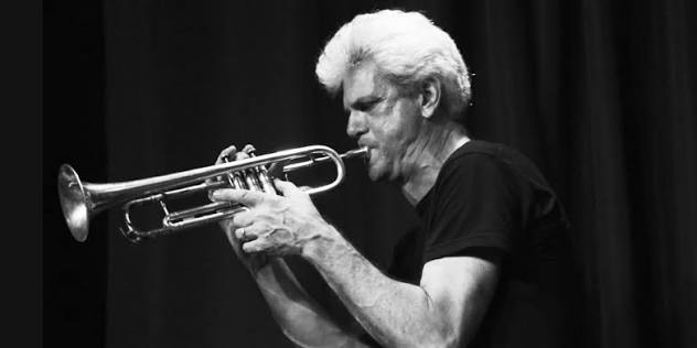 Jazz musician John D'Earth plays his trumpet
